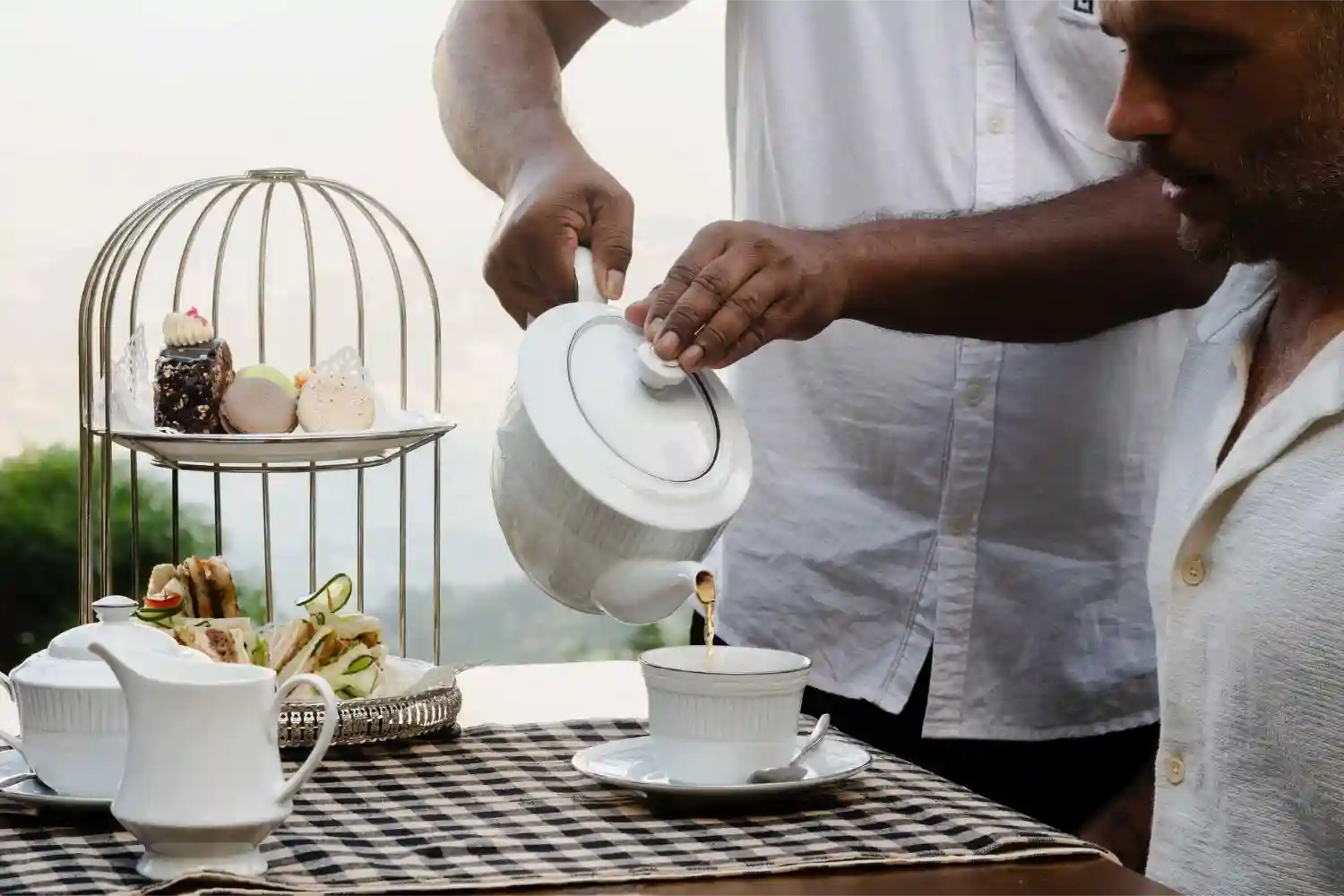 guests having tea at bawlana estate bungalow kirimetiya. private holiday bungalow in sri lanka